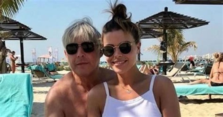 Chloe Lewis defends bikini picture with her dad's hand on her leg 'It